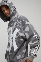 Oversized Cross Applique Camo Zip Through Hoodie