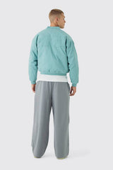 Boxy OFCL Applique Twill Padded Bomber Jacket In Light Blue